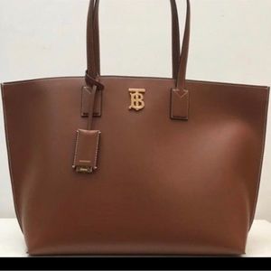 Brown tote bag with TB sign